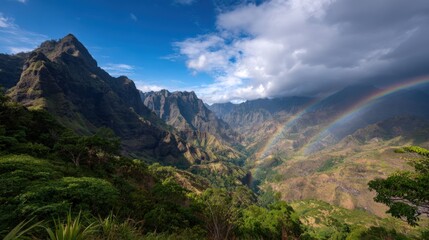 Poster - Scenic tropical mountain landscape with lush greenery dramatic sky and rainbow.
