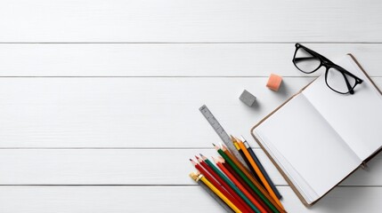 Poster - Flat Lay of Open Notebook Glasses Colored Pencils Ruler and Erasers on White Desk.