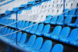 © alexkich - Plastic chairs in the stands of a sports stadium. Cheer on the stands of the stadium.