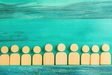 Poster - Light-tan wooden figures in a row against a teal background
