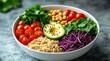 © Humairoh - Healthy bowl of fresh vegetables and grains on gray surface