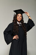 © LIGHTFIELD STUDIOS - Celebrating academic achievements with joy and confidence in stylish graduation attire