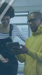 Poster - Animation of graphs, globe and computer language over diverse coworkers discussing over tablet