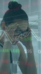 Aufkleber - Animation of stock market data processing against stressed asian woman using computer at office