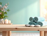 Tło spa z białymi kwiatami, roślinami, okrągłymi kamieniami i zwiniętymi ręcznikami. Baner salonu piękności. Masaż, wellness, odpoczynek, piękno