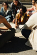 © Jacob Lund - Diverse group of young people gathered in discussion during outdoor activism event