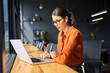 © Stock 4 You - Indian entrepreneur manager businesswoman using pc for communication, learning at workplace. Focused latin hispanic young business woman working on laptop computer sitting at office workplace desk