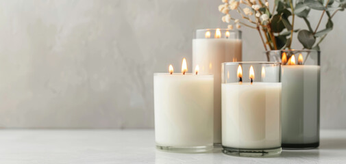 Aufkleber - Religious candle arrangement features round white candles, greenery leaves, and botanic plants creating calm, tranquil atmosphere with aesthetic appeal