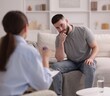 © New Africa - Professional psychologist working with patient in office, selective focus