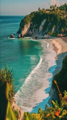 Wall Mural - A scenic beach scene with a towering cliff in the background, suitable for use in travel or outdoor-themed projects
