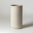 © Lokanksha - Beige Ribbed Cylindrical Vase Contemporary beige ceramic vase with finely ribbed vertical lines, perfect for adding a subtle design accent. Minimalist beige vase with textured vertical grooves