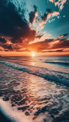 Wall Mural - a beautiful sunset scene with warm colors and calm waves