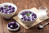 Biji Salak Ubi Ungu. Purple sweet potato salak seeds are a ball-shaped snack made from a mixture of starch and sweet potato