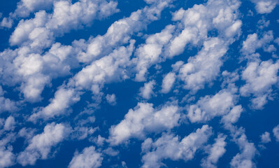 summer cloudy skies. cumulus clouds in sky. cloud wallpaper. sky background. cloudy sky with sunligh