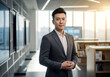 © Foto Fusion - Confident Asian Businessman Portrait In Modern Office