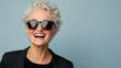 © ArtShop - A woman wearing sunglasses and smiling