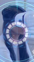 Poster - Light trails over neon scope scanner against woman gesturing while wearing vr headset at office