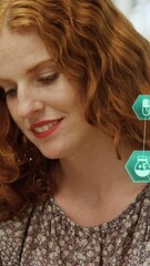 Poster - Animation of connected icons forming globes over caucasian woman talking on smartphone