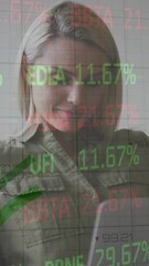 Poster - Animation of multicolored trading board and graphs over smiling caucasian woman working on laptop