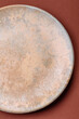 © chernikovatv - Empty round black plate for food, kitchen utensils on dining table. Empty plate