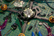 © HannaStudio - FPV drone assembly workspace with tools and components on green cutting mat