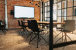 © Maskot - Chairs arranged around table in meeting room at office