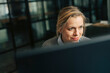 © Maskot - Smiling senior businesswoman working at office