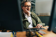 © Maskot - Bored senior businessman working on desktop PC at office
