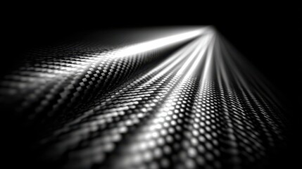 Poster - Captivating dance of light on intricate carbon fiber texture revealing a mesmerizing interplay of shadows and patterns