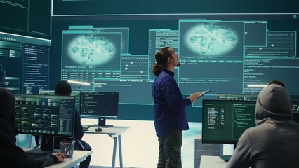Poster - Group of professional hackers gaining access into government database to steal important information for hybrid warfare. Experts work on scams and phishing activity in high tech office. Camera B.