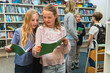 © Diego Martin/Stocksy - Children Reading Together in a School Library