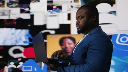 Poster - African american man on laptop immersed in a world of online content, representing the future of social interaction, AI driven platforms and modern digital experiences. User interface. Camera B.