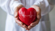 © Perfect PNG Studio - Caring hands gently hold a heart with an EKG line, symbolizing cardiovascular health, cardiology, and the importance of heart care for a long and healthy life.