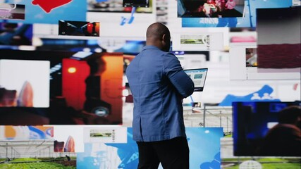 Poster - Black high tech person exploring digital world through web platforms, reflecting trends in social media, video sharing and user interface design within online environment. Camera A.