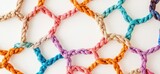 Colorful braided ropes forming a geometric pattern.