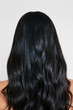 © Ángela Rober/Stocksy - Back View of Long Shiny Black Hair with Natural Waves