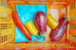 © Natalia Mishina/Stocksy - Fresh vegetables in a vibrant orange basket ready for cooking