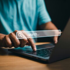 Person typing on laptop searching online image