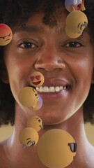 Poster - Animation of falling emoji icons over portrait of african american woman