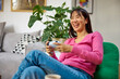 © Boris Jovanovic/Stocksy - Excited woman plays video games