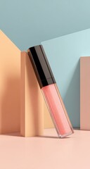 Poster - A translucent peach lip gloss tube with a black cap rests diagonally on a pastel pink surface, partially obscured by peach and blue geometric shapes