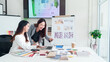 © Pichsakul - Asian Interior Designers Collaborate on Project, Reviewing Plans and Color Palettes for Home Decor, Modern Design Ideas, & Architecture Solutions