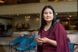 © Ranta Images - Woman using mobile phone in cafe restaurant