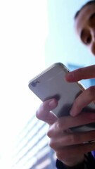 Poster - Animation of globe with network and icons over businesswoman using smartphone