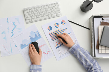 Fototapete - Woman with pen and business charts working at table in office, closeup