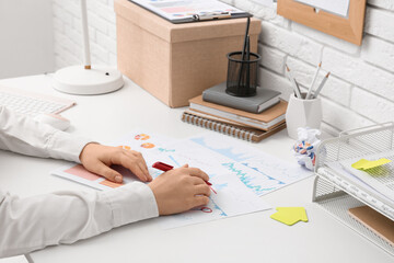Fototapete - Woman with business charts working at table in office, closeup