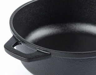 Black cast iron skillet with two handles, close-up view showcasing its textured surface and smooth interior.