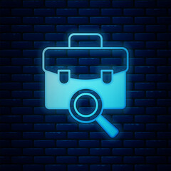 Fototapete - Glowing neon Magnifying glass with briefcase icon isolated on brick wall background. Job hunting. Work search concept. Unemployment, head hunting, career. Vector