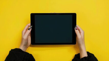 Poster - A person holding a tablet computer, possibly browsing or taking notes