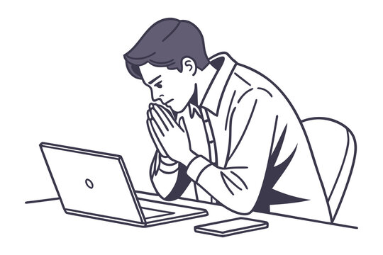 A focused man sits at a desk with his hands clasped in front of his face contemplating a laptop and smartphone